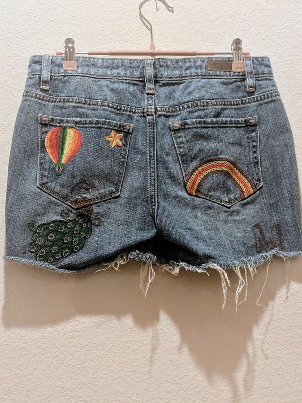 Miss Me denim shorts with embroidery on front and back, size 27, 3.5" Inseam